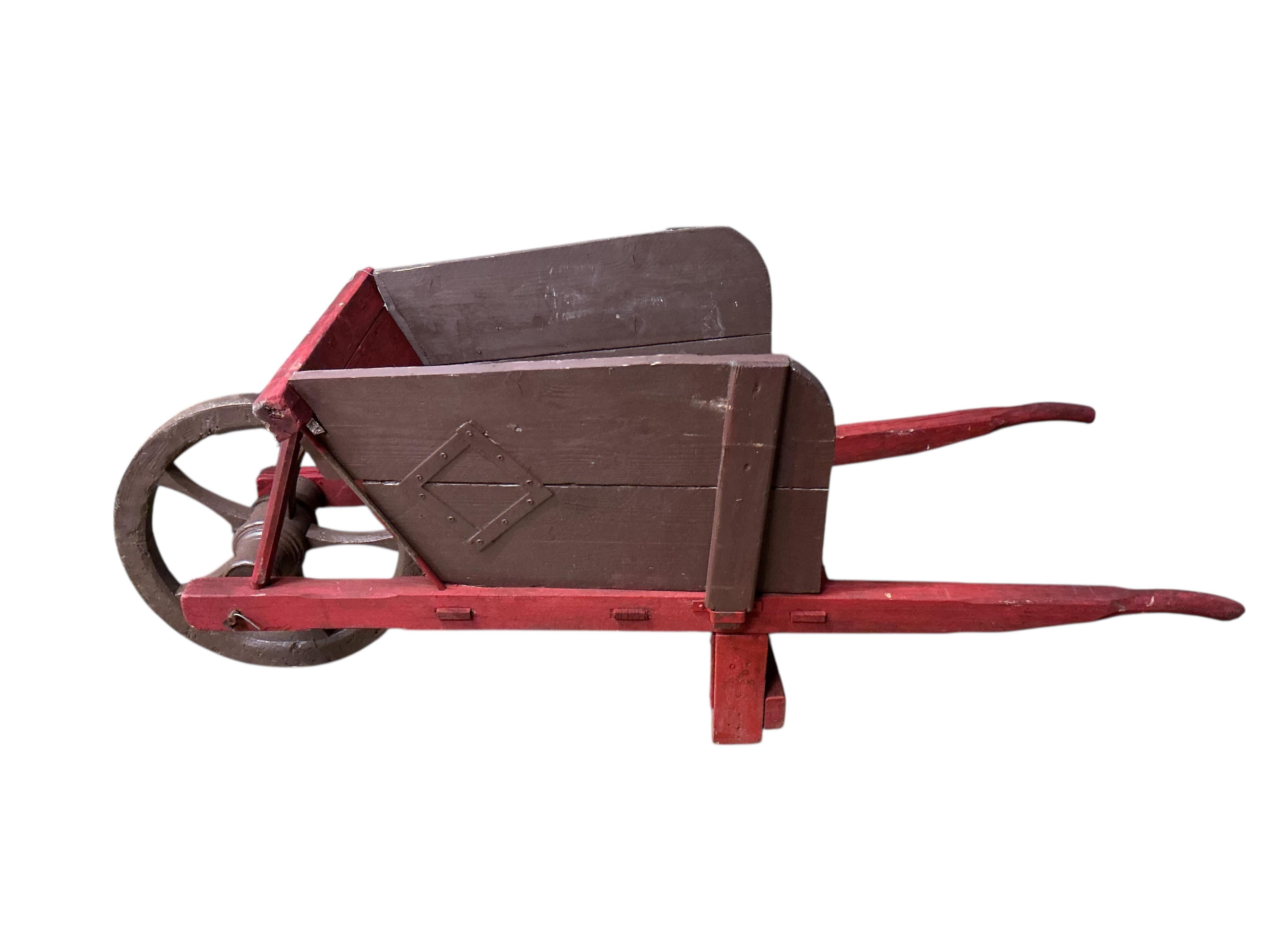 A painted rustic garden wheelbarrow, width 58cm, length 158cm, height 70cm